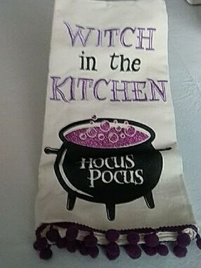Spirit Halloween Tea Towel with Purple Bubbly Cauldron and Black Lettering